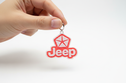 Hand holding Jeep Keychain