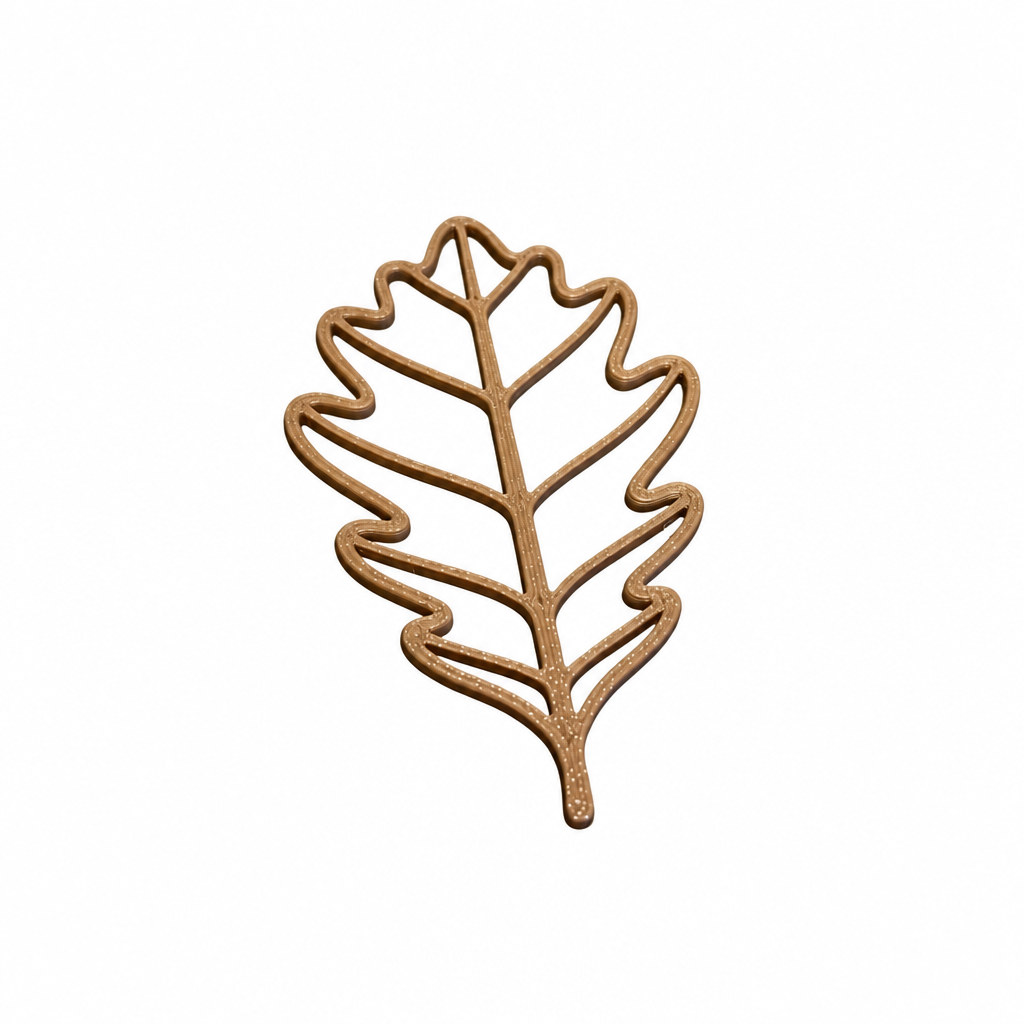 3D printed brown oak leaf decor piece on a white background