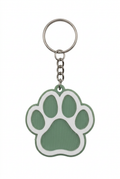 Sage green and white paw print keychain on a white background